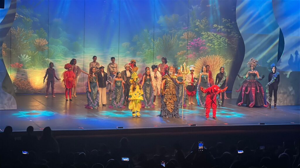 Cast of a children's stage production on stage