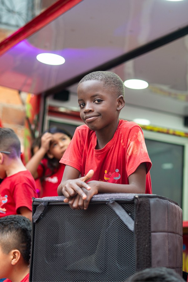 Joel, one of the two boys Rachel sponsors through RTU, at a community outreach event