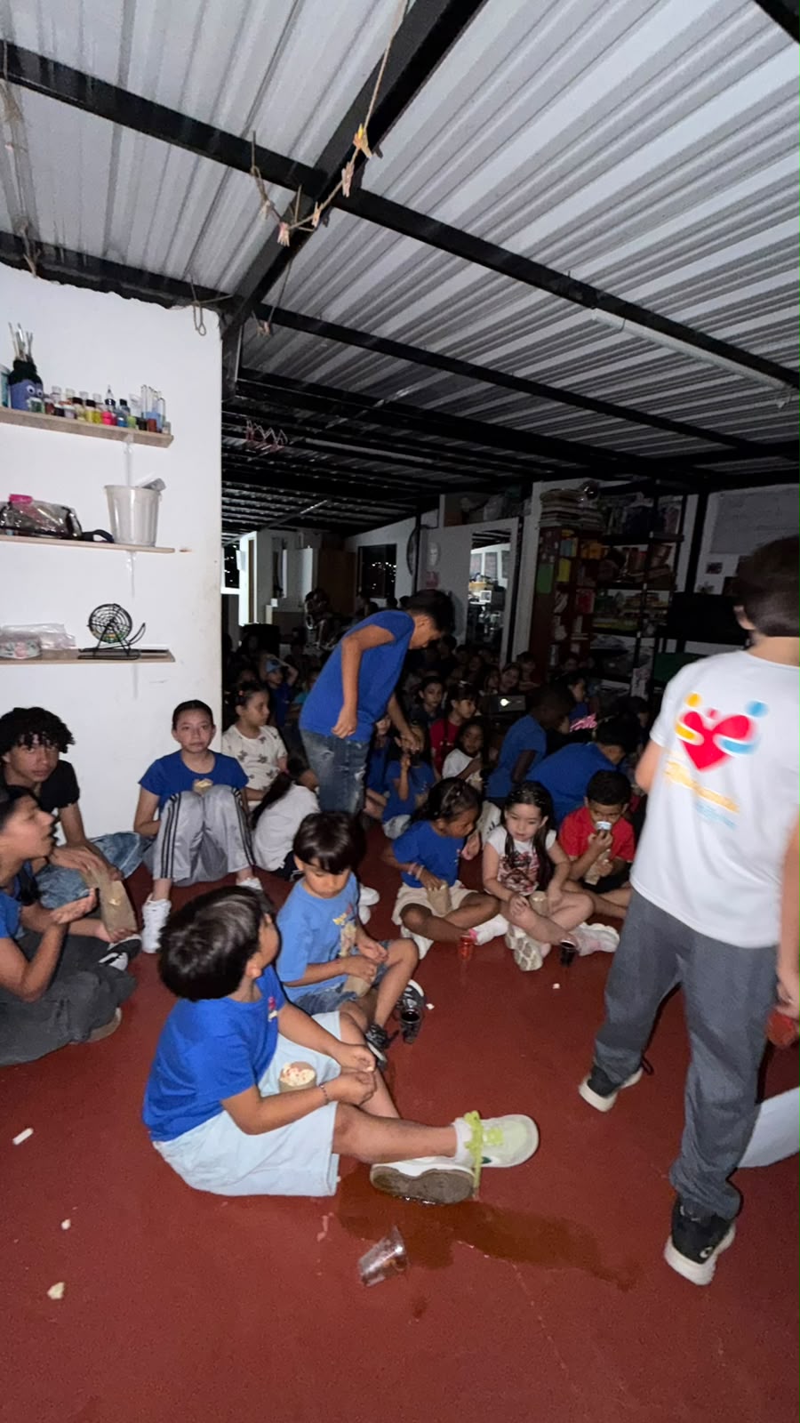 Large crowd of children seated watching