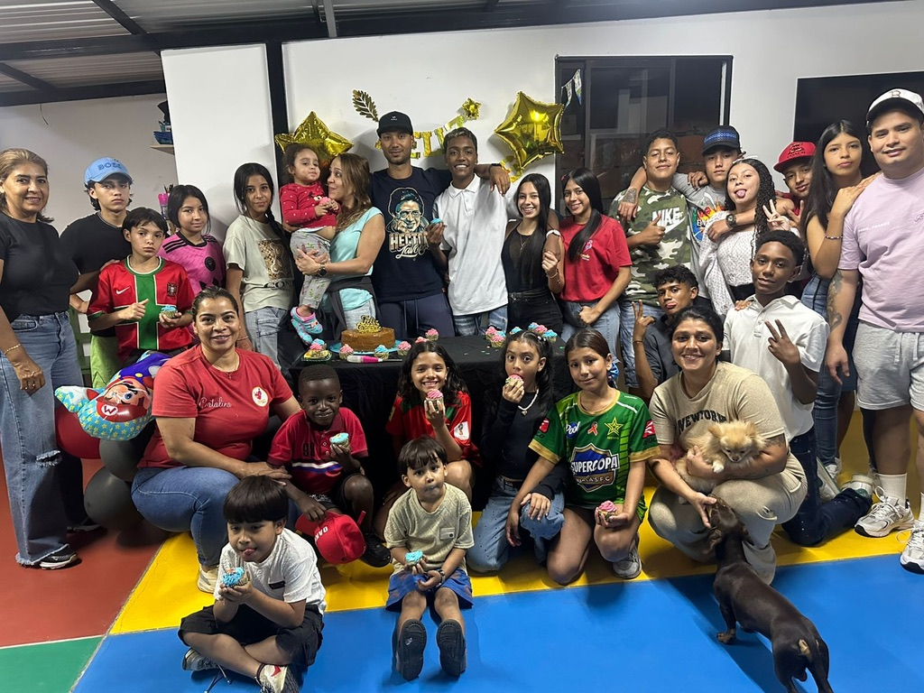A big group celebration with families and volunteers.