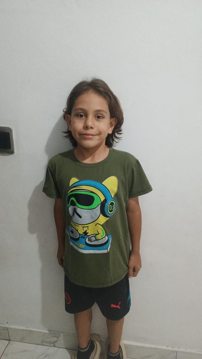 A boy in his new shirt.