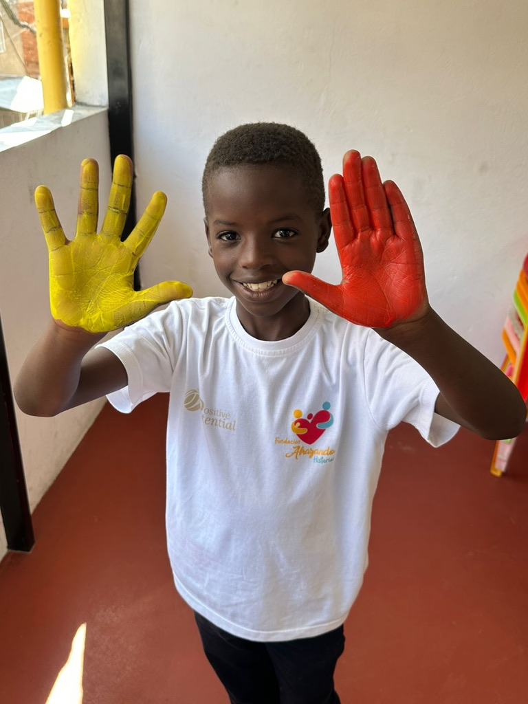 Painted hands and a big smile.