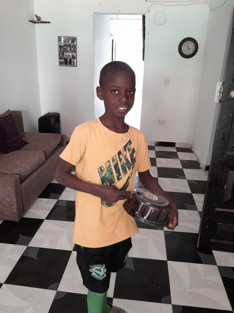 A young boy with his cake to take home.