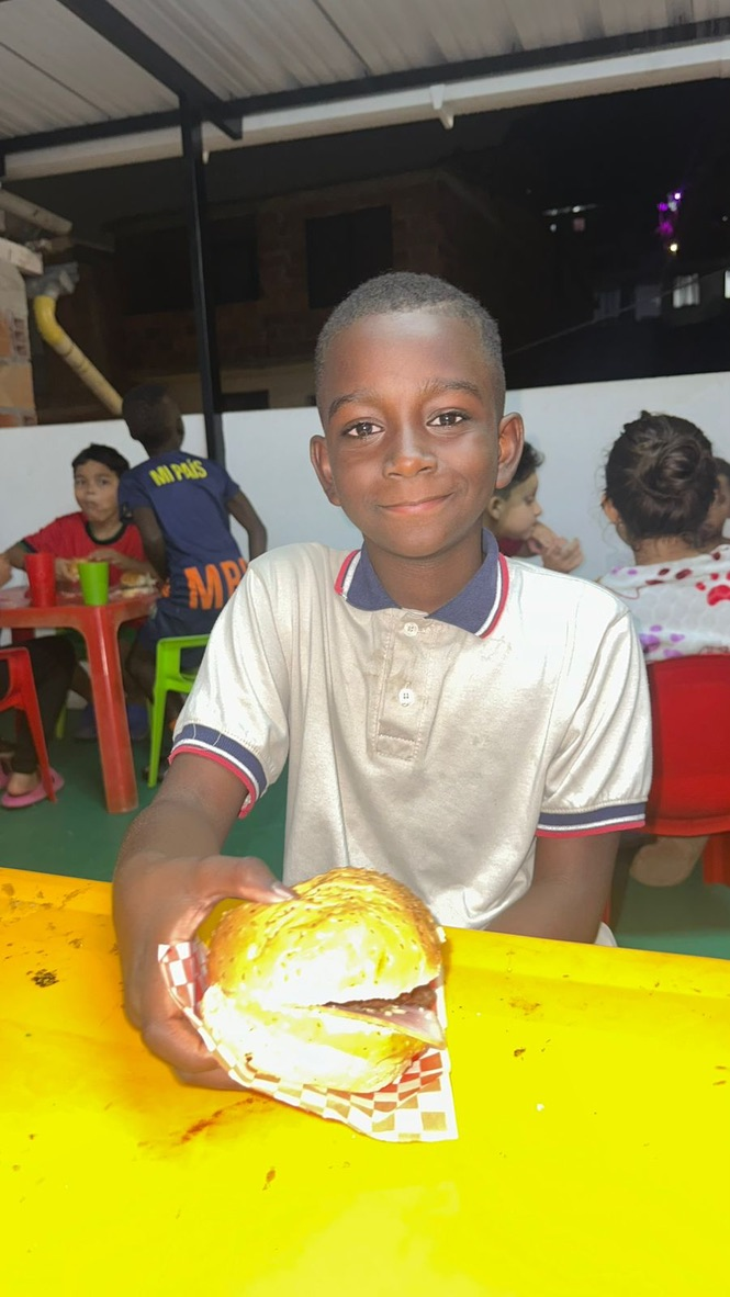 A boy shows off his craft.