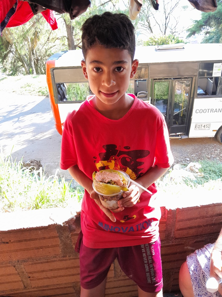 A young boy with his snack.