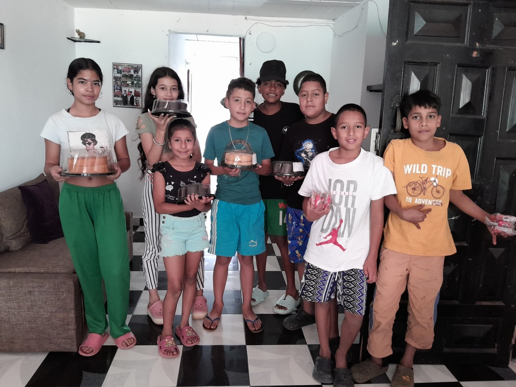Children take home cakes to share with their families.