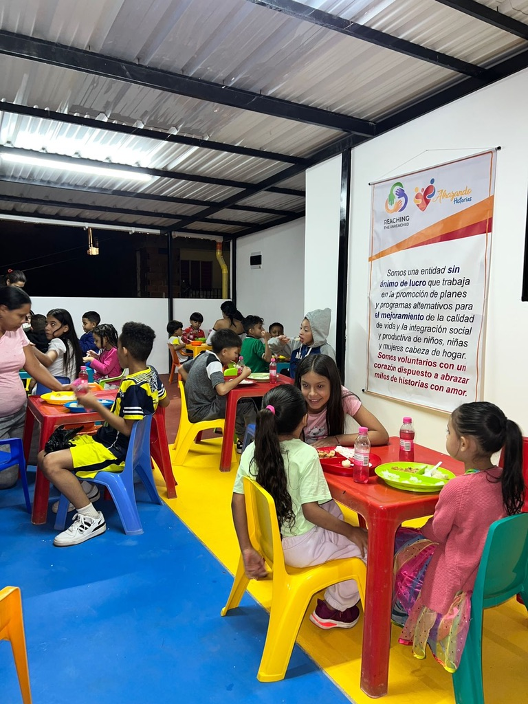 Children share a meal at the community center.