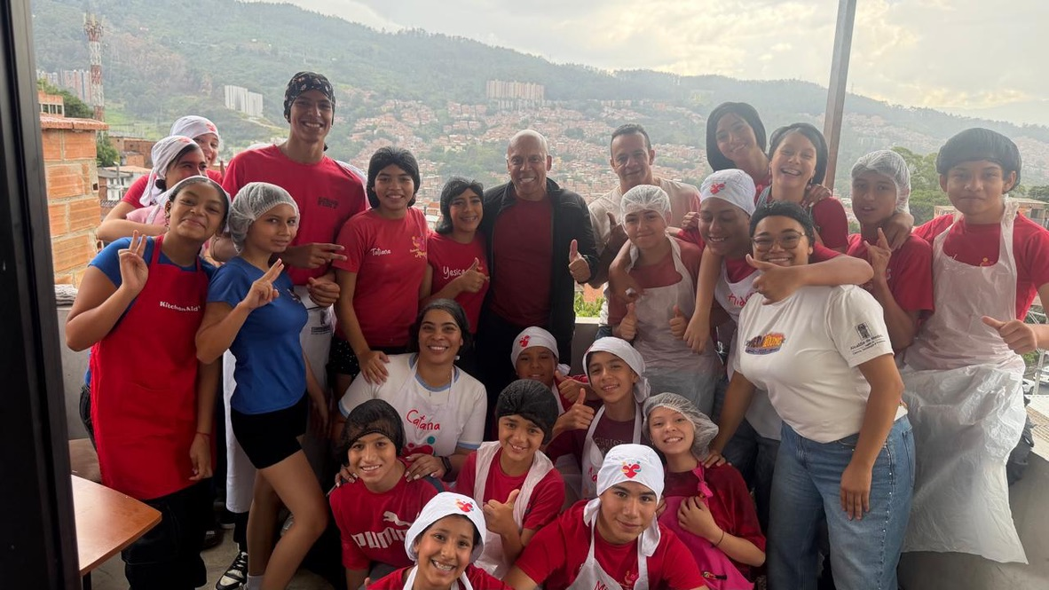 Coach Chonto with the children of Abrazando Historias above Medellín, October 2026.