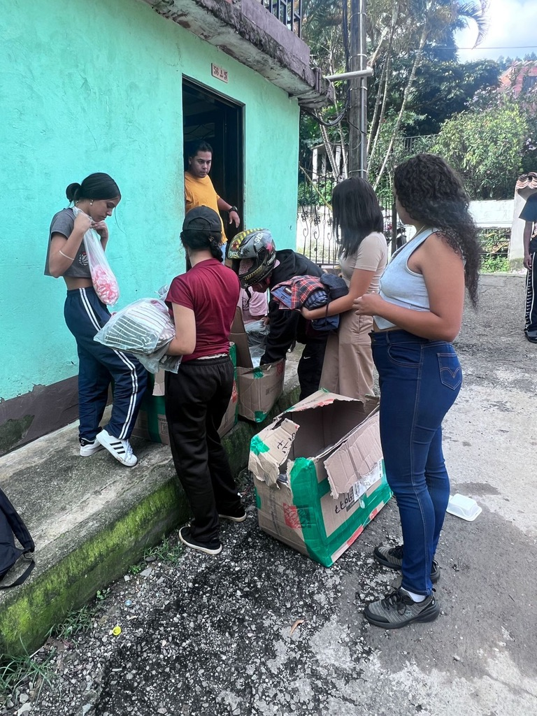 The clothing drive at a family doorway.