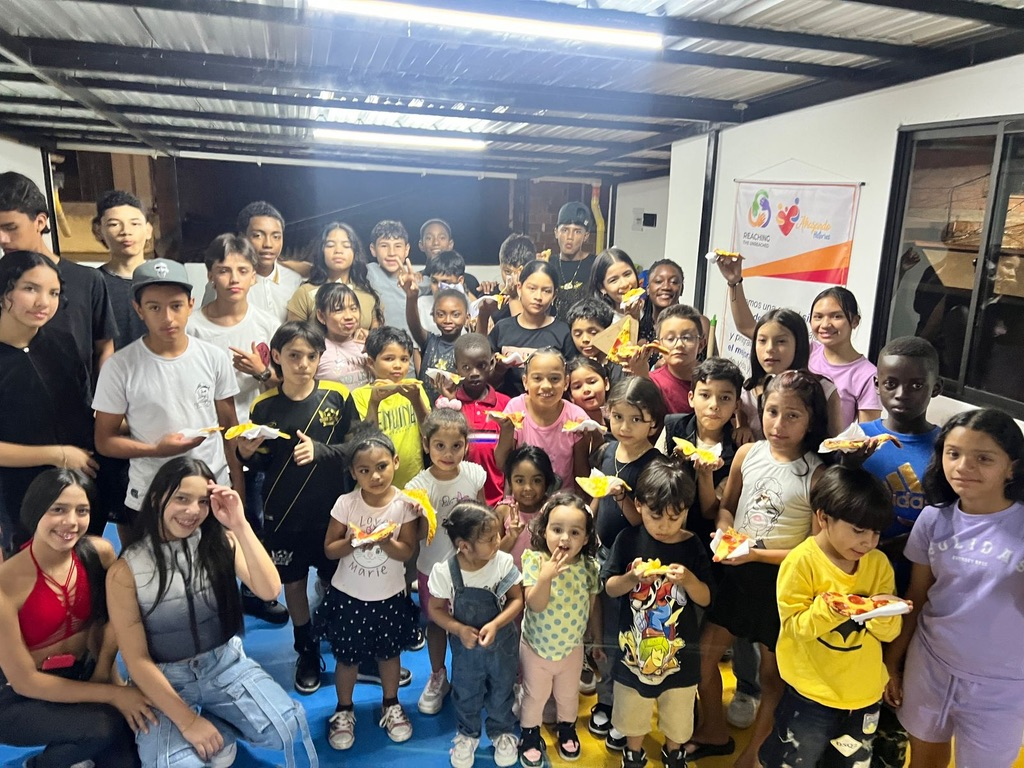 The whole group together at the community center.