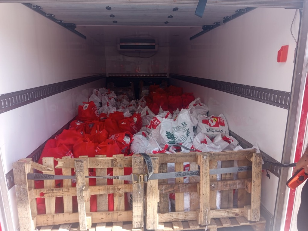 Bags of food loaded for delivery to families in need.