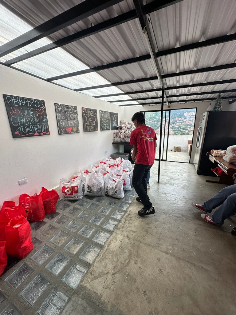Bags of food lined up for families in need.