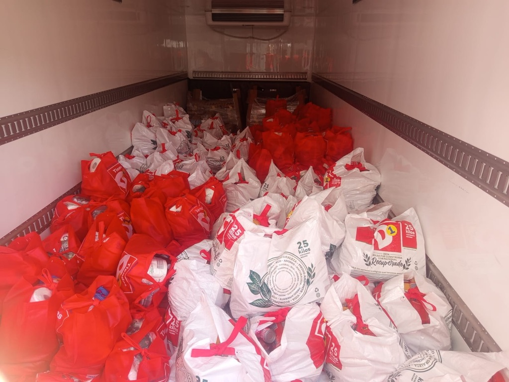 A truck full of food bags for families in need.