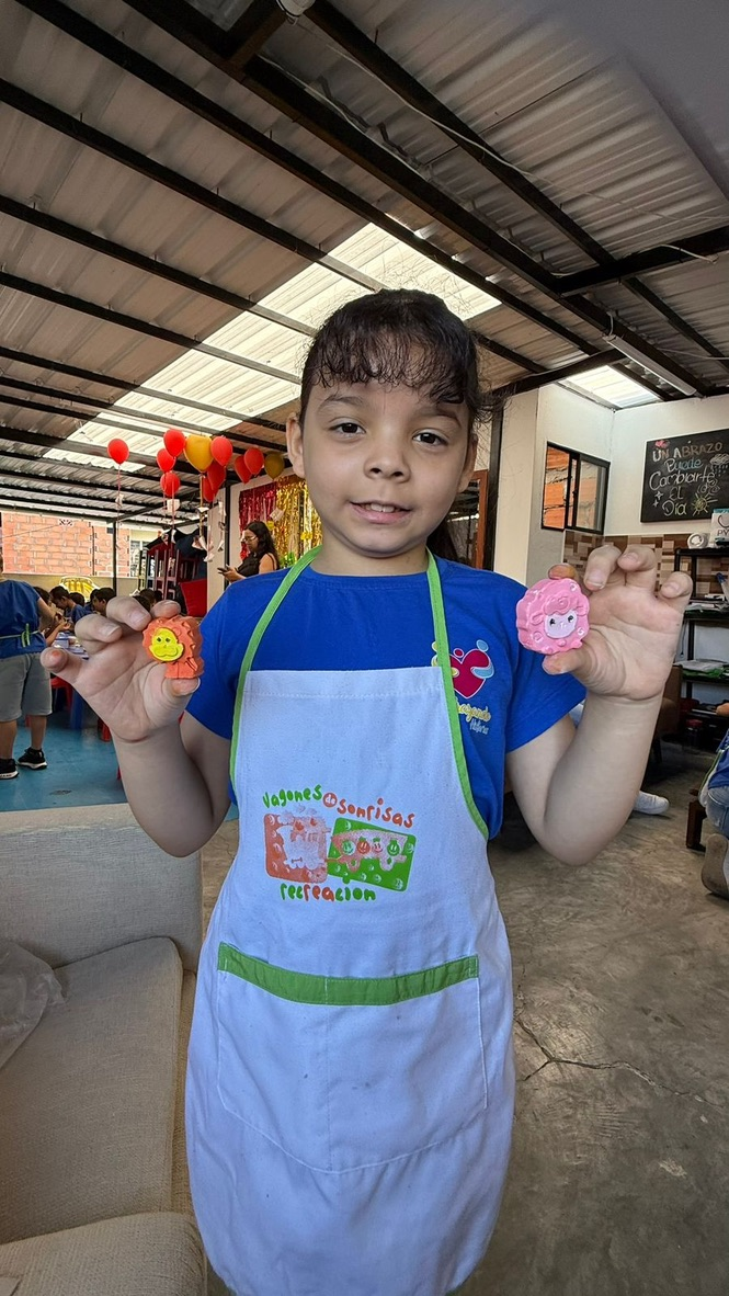 Proud of her handmade crafts.