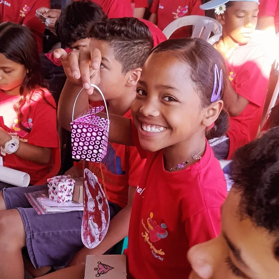 A big smile and a gift bag at an RTU celebration.