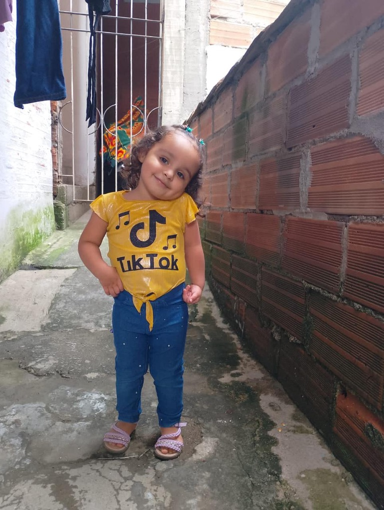A young girl in her neighborhood.