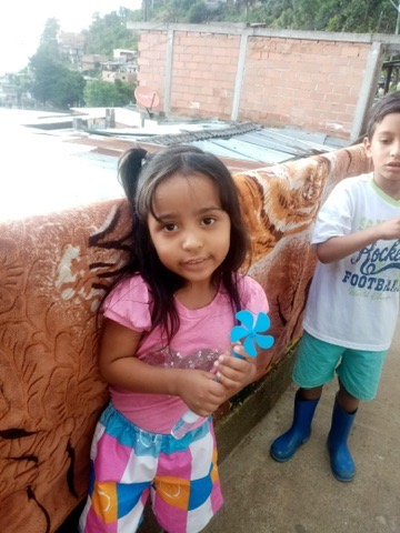 A little girl in the neighborhood after the storm.