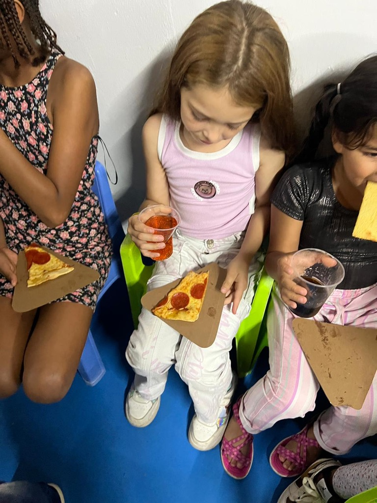 Girls eating together at the center.