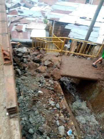 Damage left by the landslide in the neighborhood.