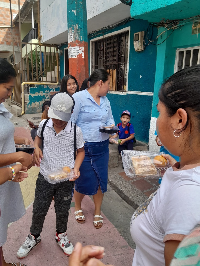 Handing out meals in the neighborhood.