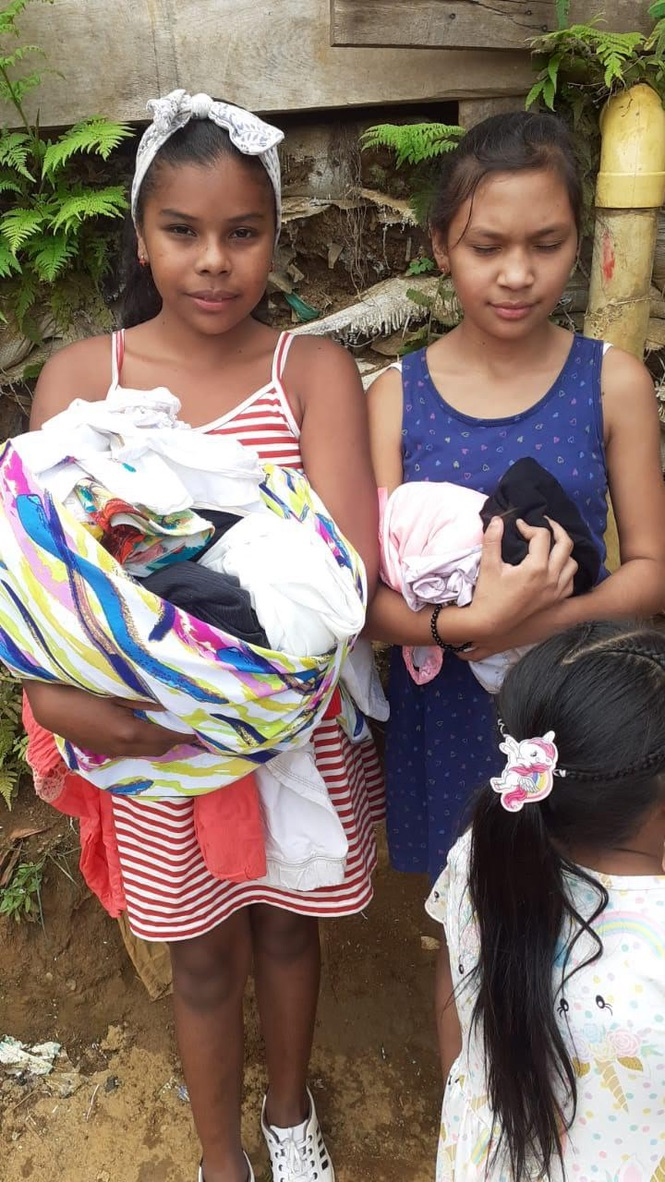 Two sisters with their new clothes.