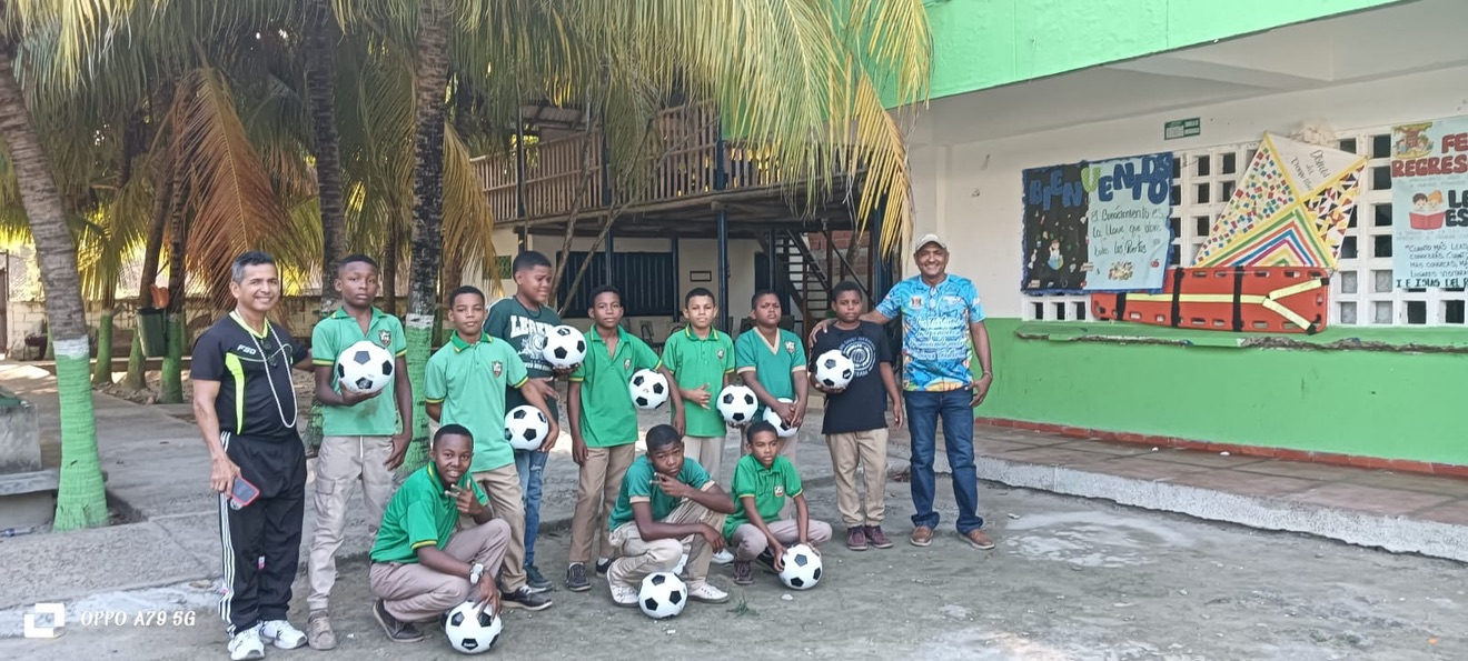 Young players with their new soccer balls.