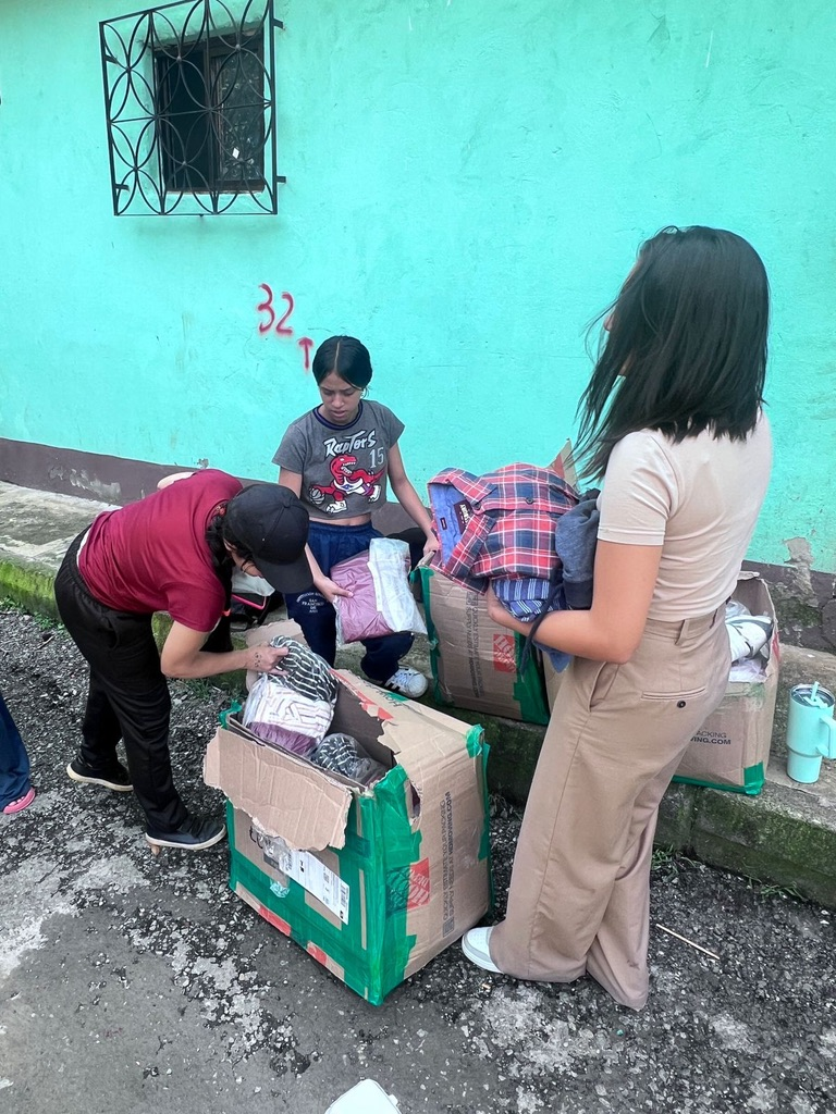 Sorting donation boxes on the street.