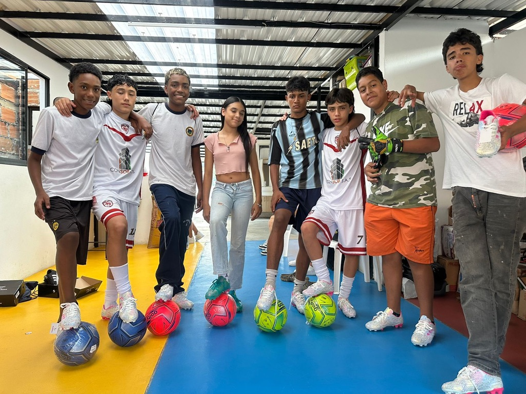 Young players with their new soccer balls.
