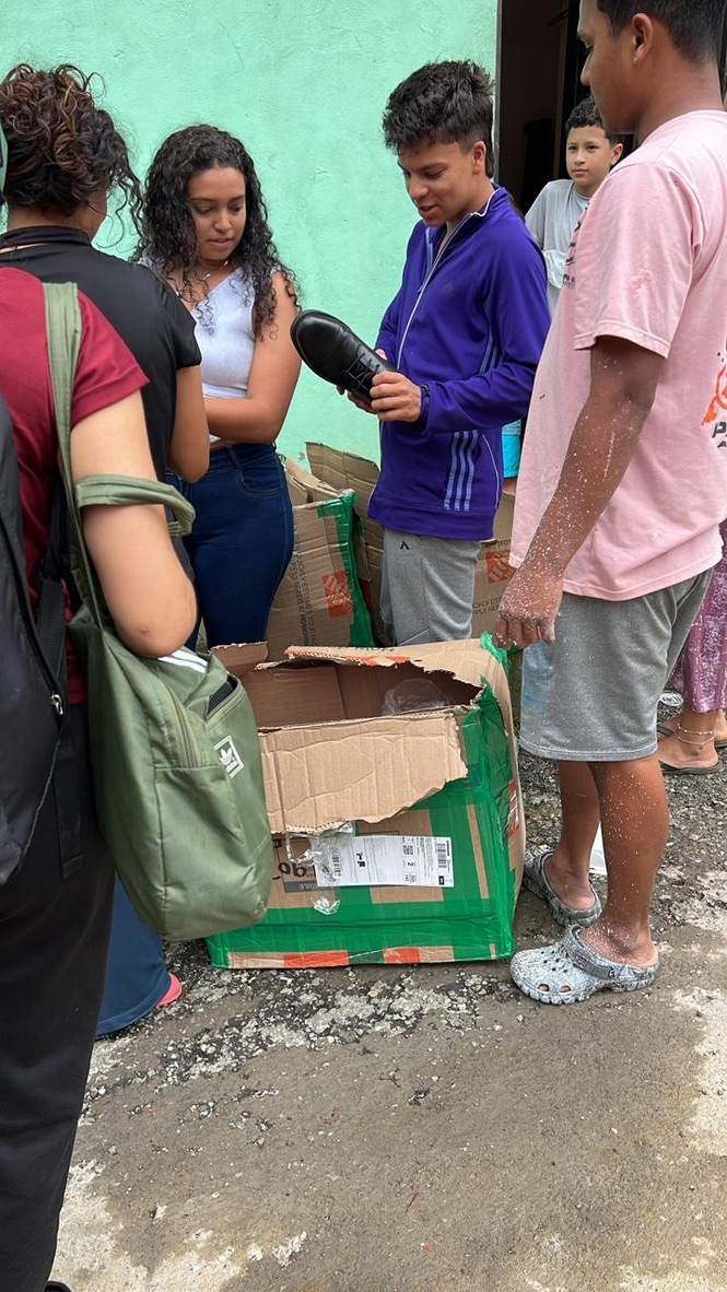 A teen checks out a new pair of shoes.