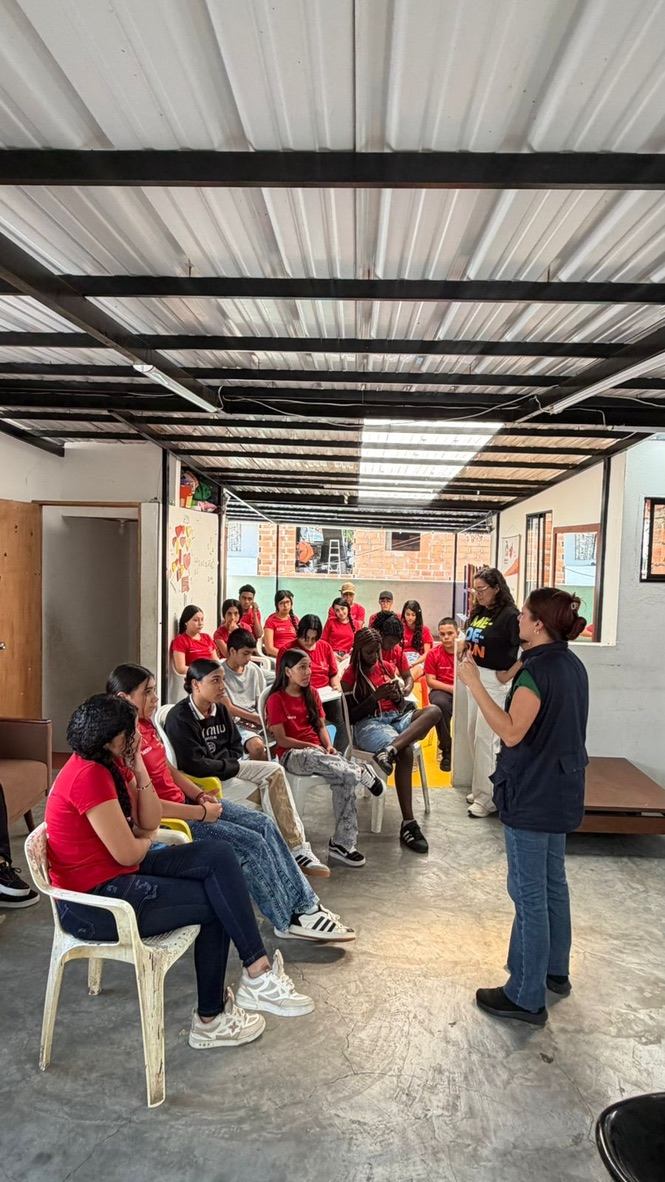 Teens at a workshop led by a guest speaker.