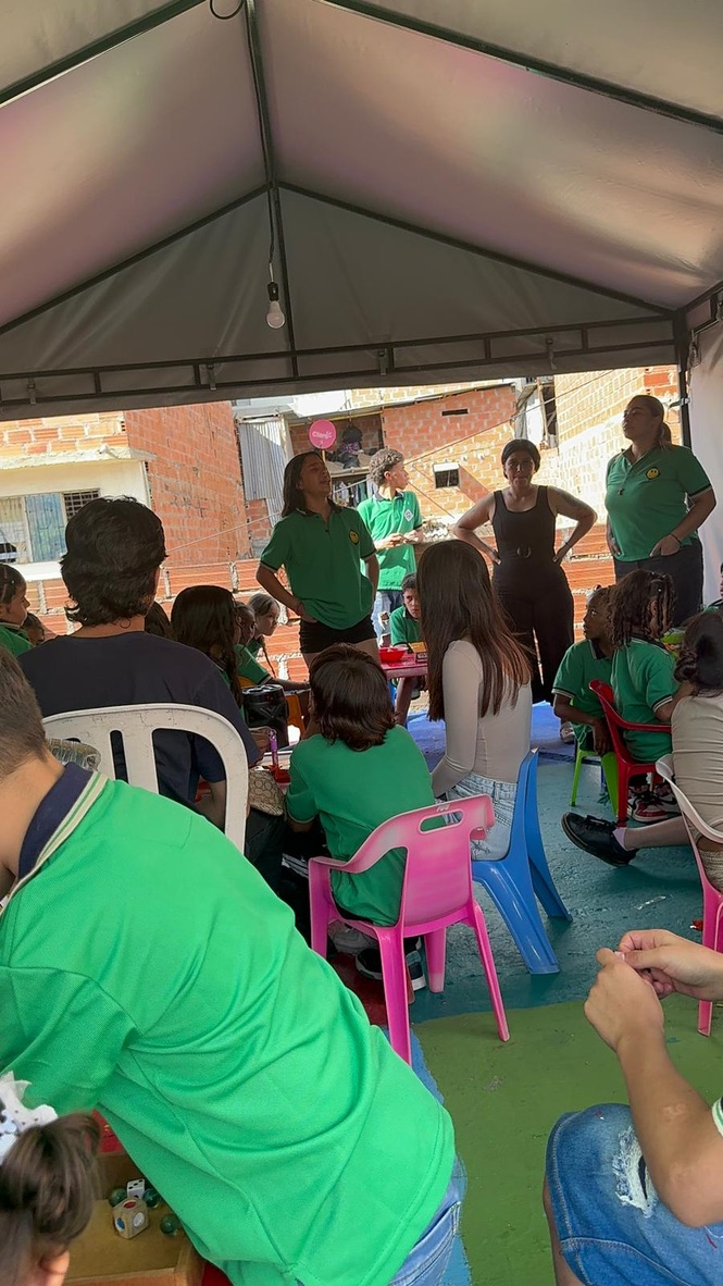 Children at an activity under the tent.