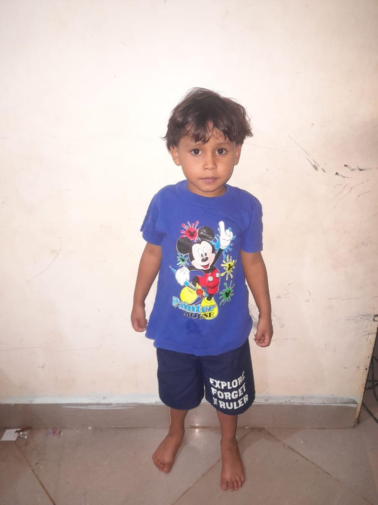 A little boy in his new shirt.