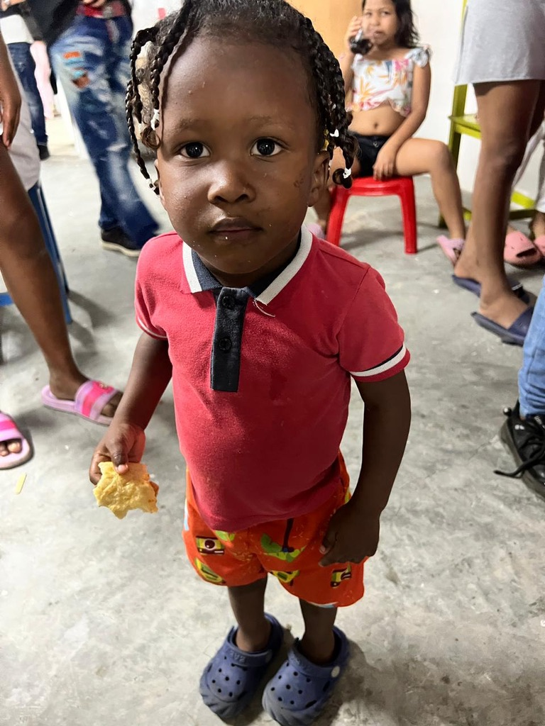 A little one in red at the community center.