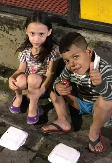 Two thumbs up from two young friends.