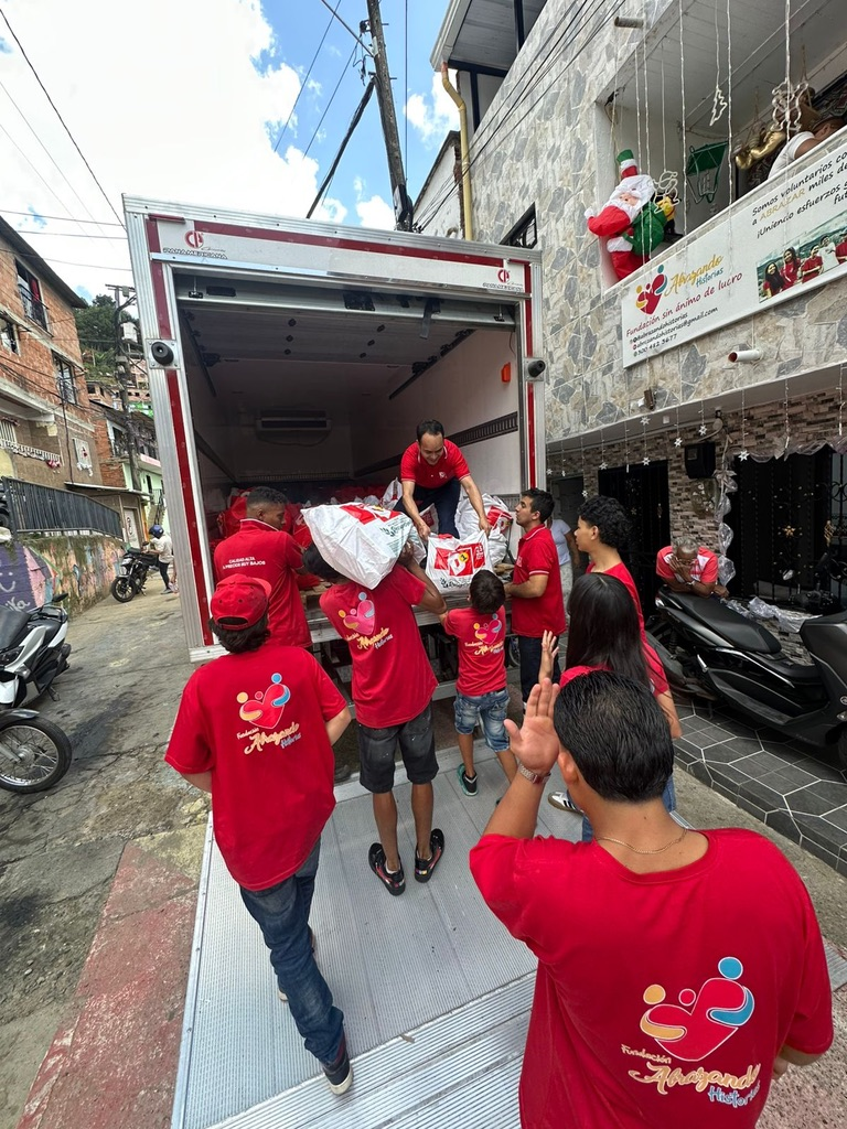 Unloading bags of food for families in need.