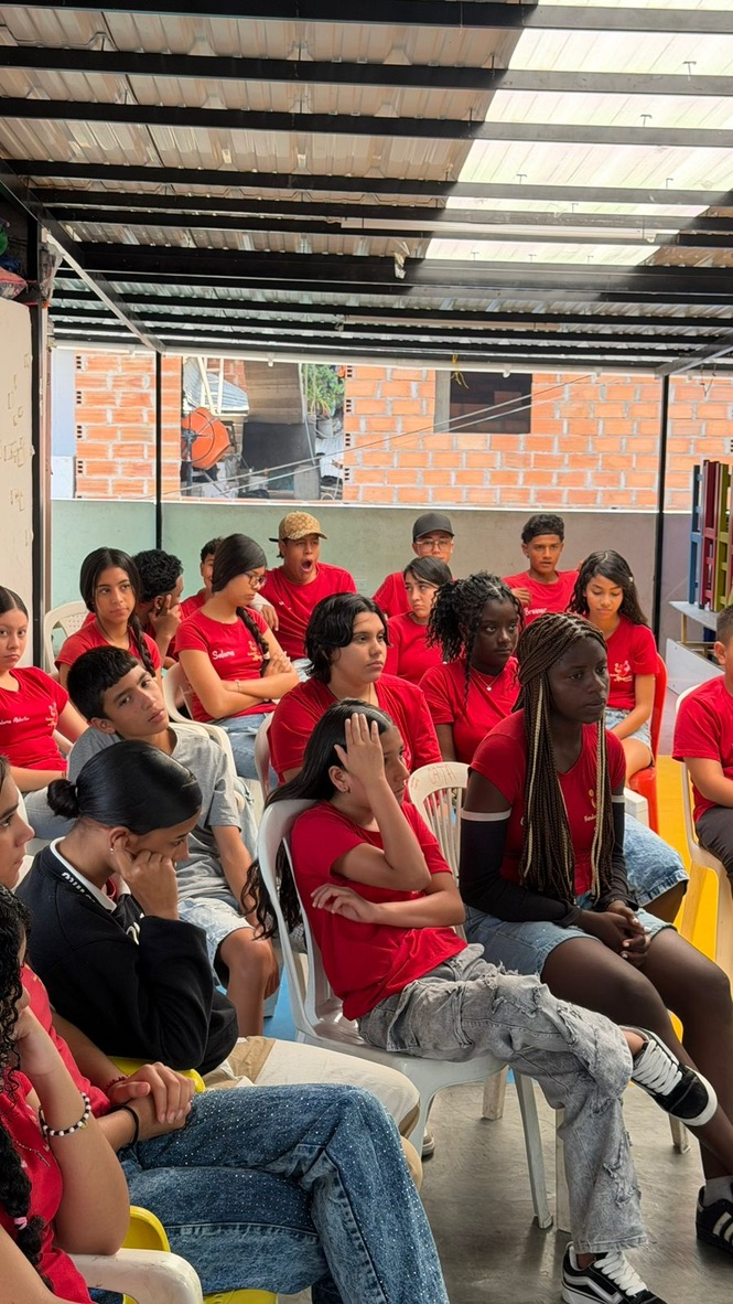 Teens listen during a workshop in Medellín.